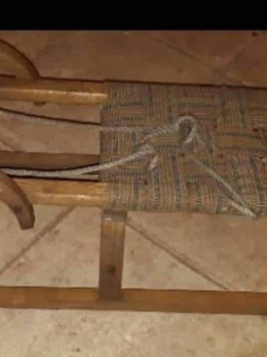 Swiss sled used from 1958 with wooden frame and fabric seat