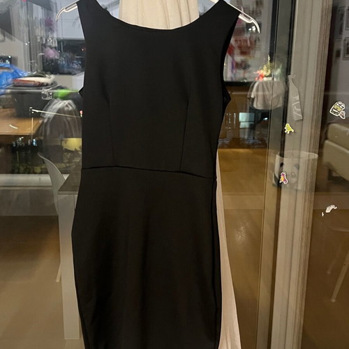 Black mini dress size S like new polyester with open back and large bow