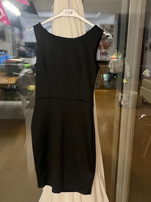 Black mini dress size S like new polyester with open back and large bow