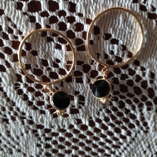 Earrings like new gold-colored stainless steel with black stones