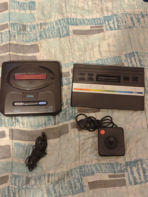 Atari 2600 and Sega Mega Drive 2 consoles
