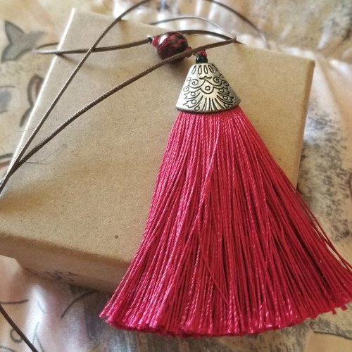Necklace with red tassel used