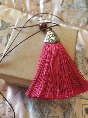Necklace with red tassel used