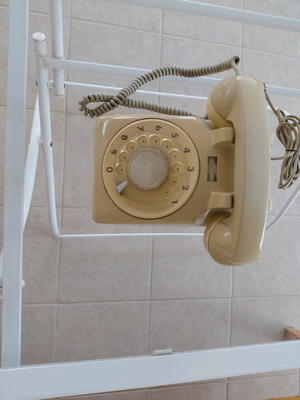 Two OTE wired telephones, beige