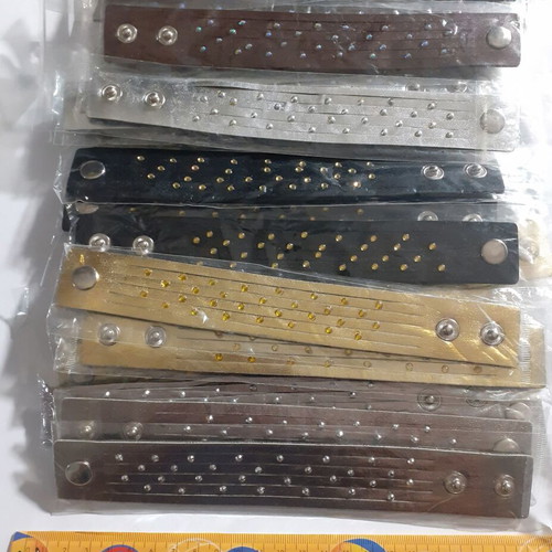 Pack of 135 denim and faux leather bracelets with rhinestones