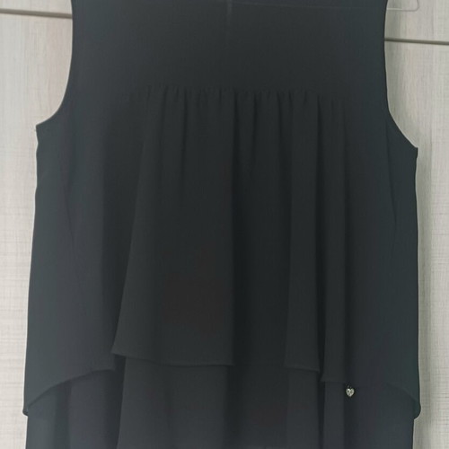 Sleeveless women's blouse black like new with ruffles and sheer detail
