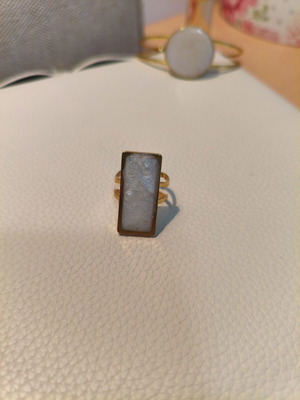Handmade adjustable statement ring with white resin and gold base