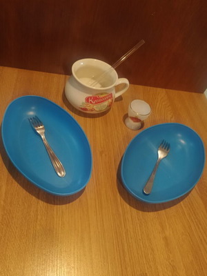 Kitchen items used set with egg cup, soup bowls, glass straw, and forks
