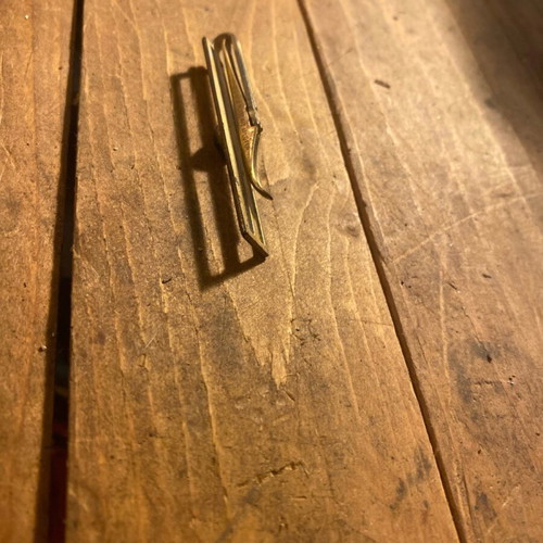 Metal tie clip used, gold color, 6 cm length