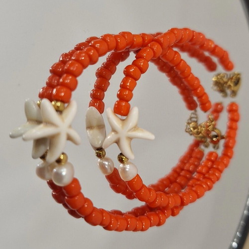 Handmade summer bracelet with glass beads, pearls and steel elements