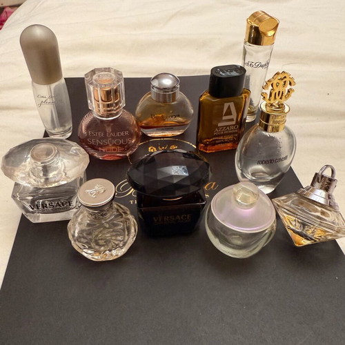 Collection of 11 authentic miniature perfumes like new