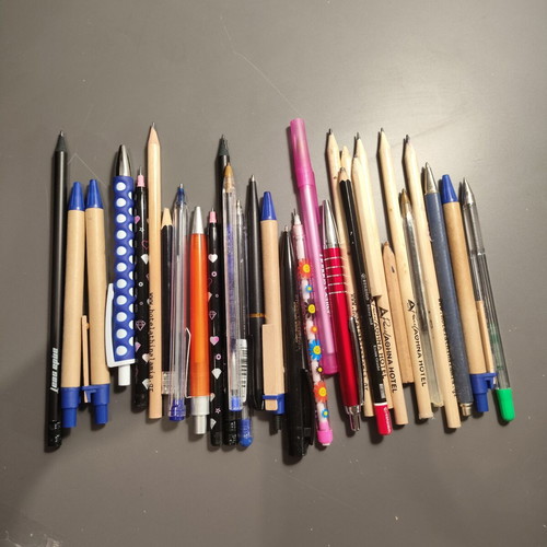 Set of pens and pencils used, some promotional