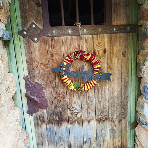 Handmade autumn decorative wreath with wooden thankful sign