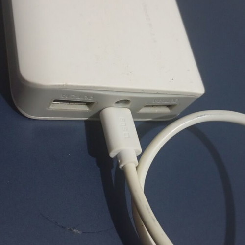 USB charger with flashlight, used, two charging ports