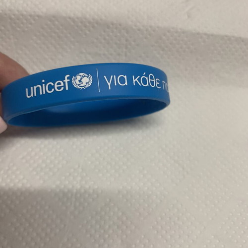 Unicef bracelet new, blue rubber with message