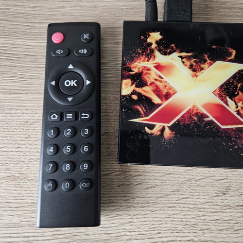 Vontar X1 Smart TV Box used with remote and power adapter