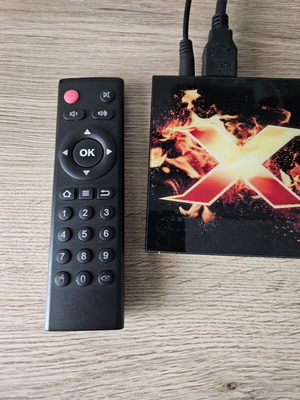 Vontar X1 Smart TV Box used with remote and power adapter