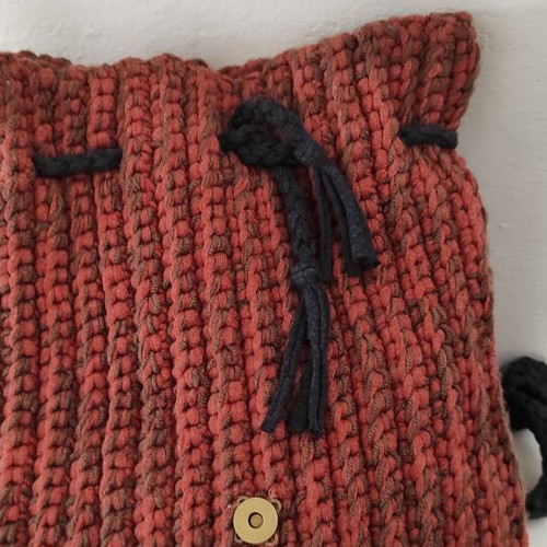 Knitted backpack like new, orange with leather hamsa detail