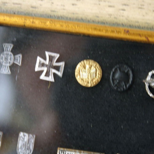 Frame with 27 old German Nazi military badges from World War II like new