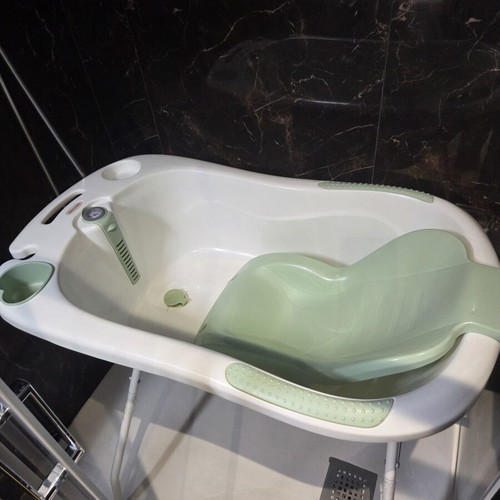 Baby bath with seat, thermometer and stand
