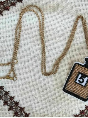 Long necklace with No5 cologne bottle applique and sequins, gold chain