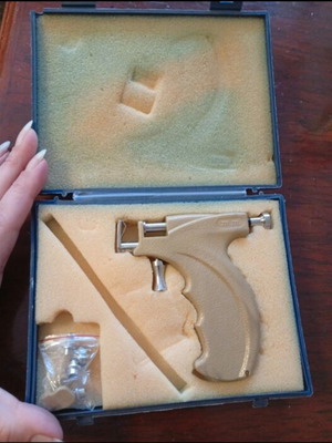 Ear piercing system used with multiple tips and guidance