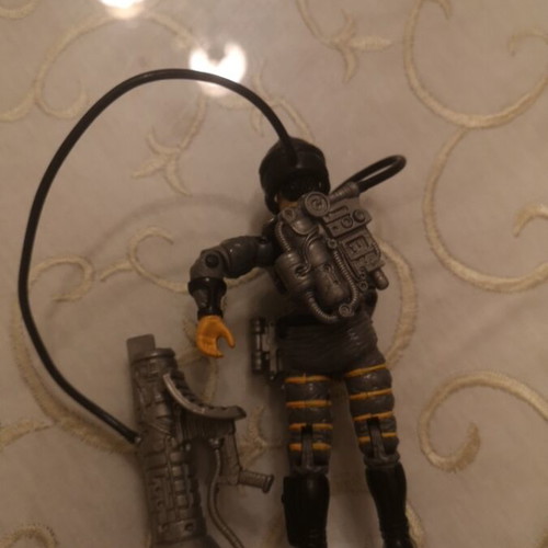 G.I. Joe action figure with weapons