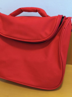Toiletry bag used, red, practical and spacious travel case