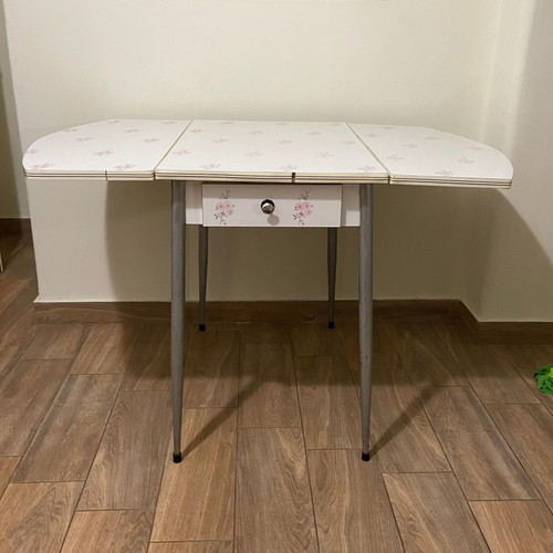 Formica kitchen table used, extendable with almond blossom design and drawer