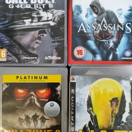 Pack of 4 used PS3 games: Haze, Call of Duty Ghosts, Killzone 2, Assassin's Creed