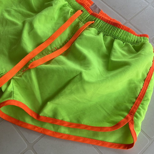 Men's swim shorts like new, fluorescent green with orange details