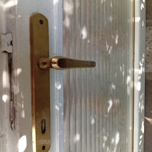 Interior wooden door with glass and gold handle