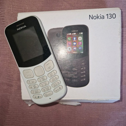 Nokia cell phone used, white, battery needed