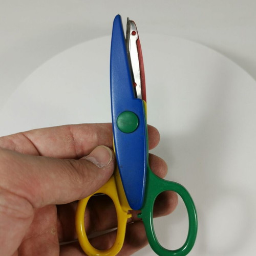 Craft scissors used with colorful zig-zag cuts for kids