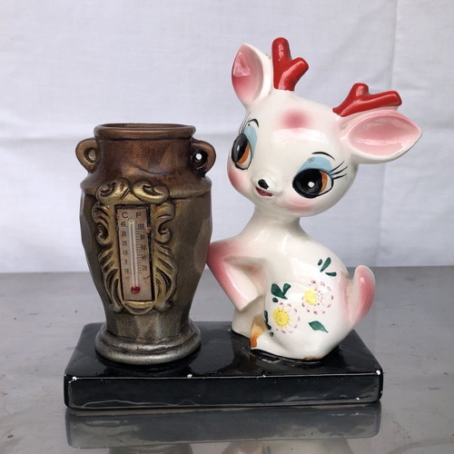 Ceramic decorative vase with thermometer used