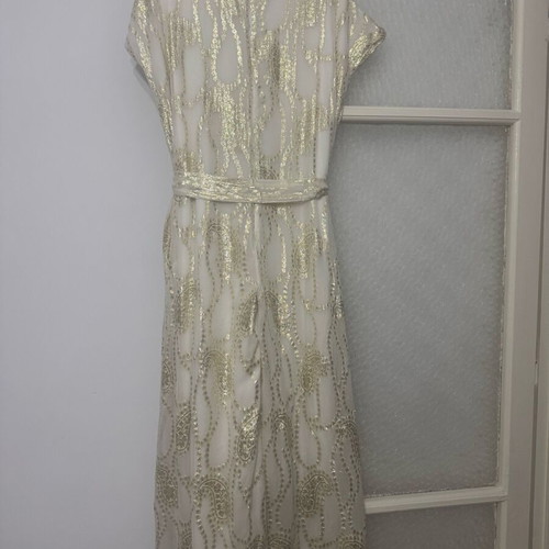 Overall jumpsuit with a belt.