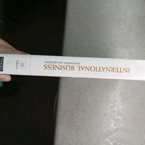 International Business 11th edition book like new, Deree college
