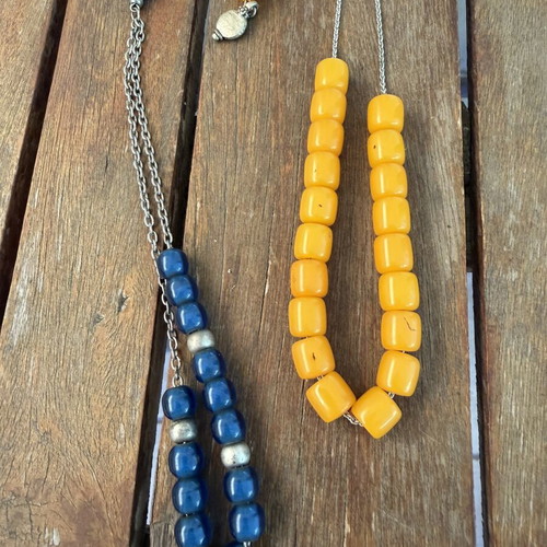Set of two komboloi like new, one yellow and one blue