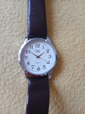 SK wristwatch with stainless steel back cover