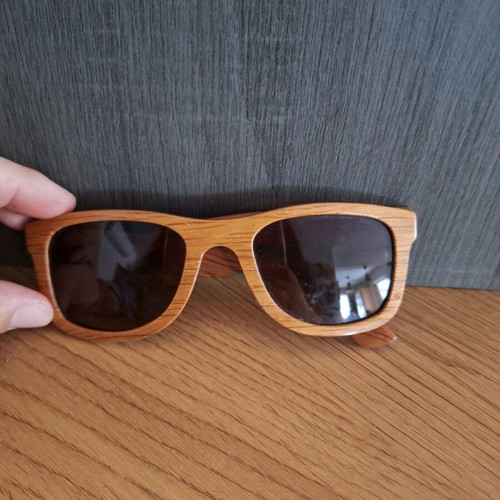 Woody wooden sunglasses used, with arm needing screwing