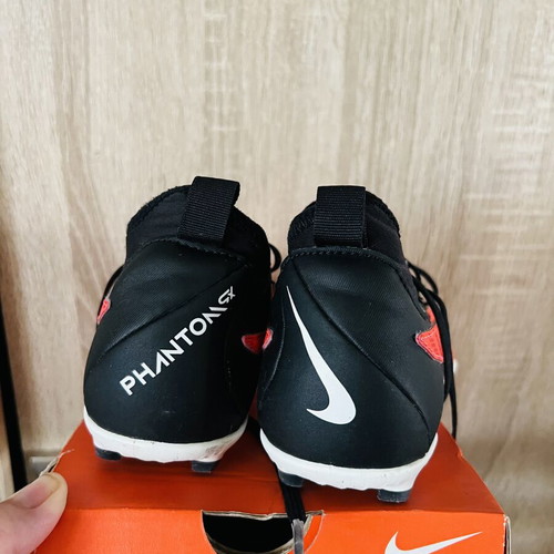 Nike football shoes like new, sizes 22 and 35, black and red