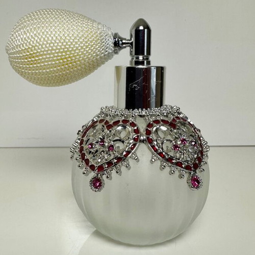 Vintage perfume bottle with pump, decorative hearts and crystals