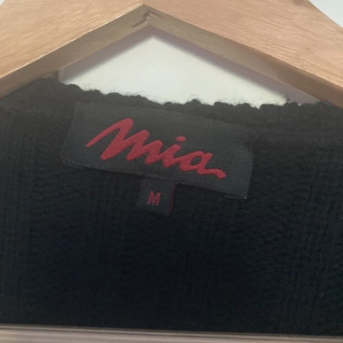 Vintage leather jacket used with knitted wool sleeves and embroidered details