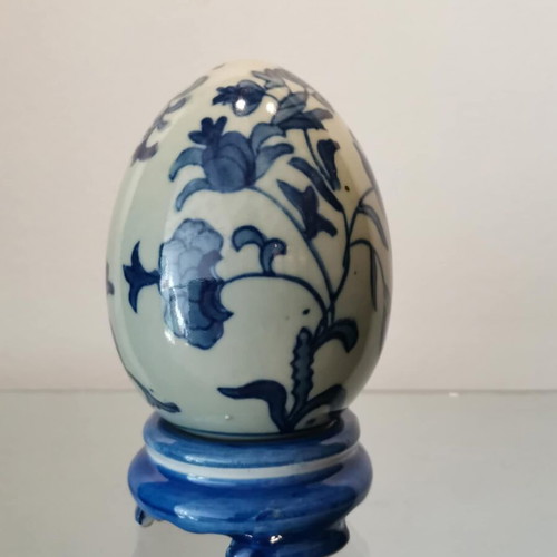 Porcelain egg used with blue designs and stand