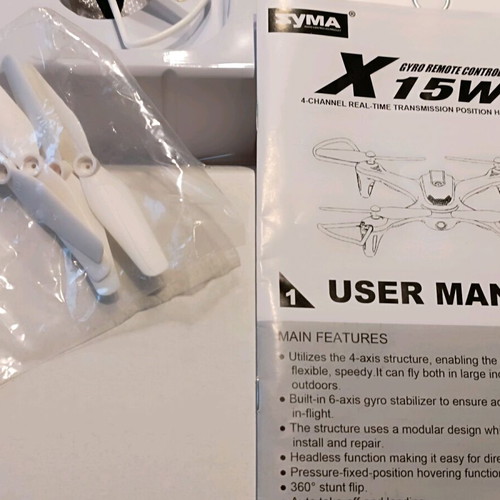 Syma X15W drone used with remote control and video mount