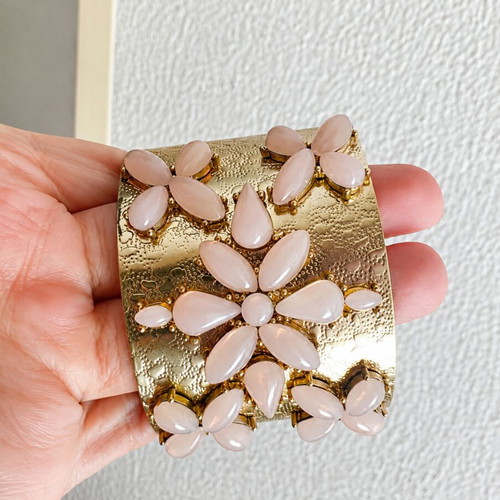 Gold bracelet with pink details