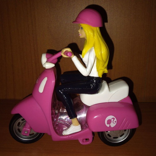 Barbie figure on motorcycle used with motion