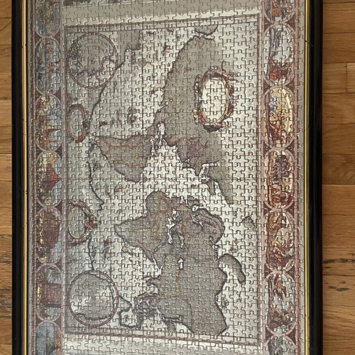 Old collectible holographic puzzle in frame