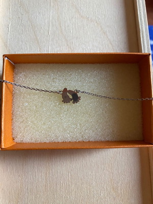 Silver bracelet unused with baby feet design
