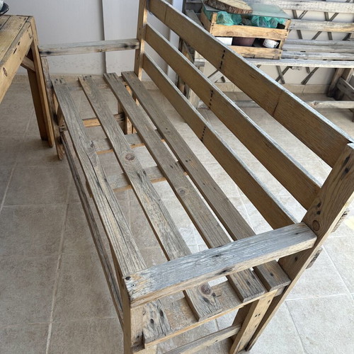 Handmade wooden table set with chairs and bench used